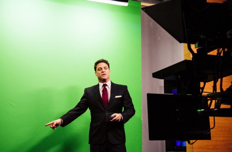 WCSH-TV meteorologist Tom Johnston presents the weather report during the 5 p.m. news broadcast Tuesday. Viewers see the weather maps and text on the “green screen” behind Johnston, who had correctly predicted the snow accumulation for Monday.