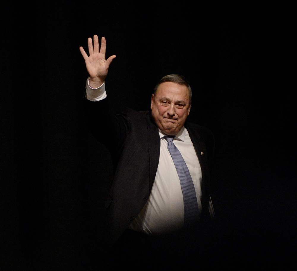 Gov. LePage waves to the crowd as he leaves the stage at Windham High School on Tuesday night.