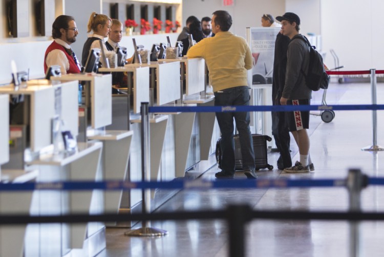 Few travelers were at the Portland International Jetport on Friday because a snowstorm in the Mid-Atlantic states caused many flight cancellations.
Carl D. Walsh/Staff Photographer