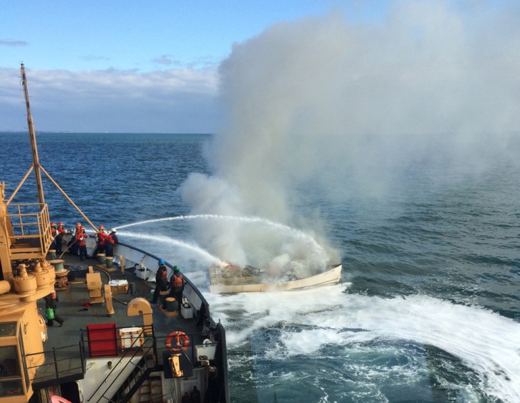 Crew from the U.S. Coast Guard cutter Willow extinguish a fire aboard the Miss Lynn off Port Clyde on Thursday morning.