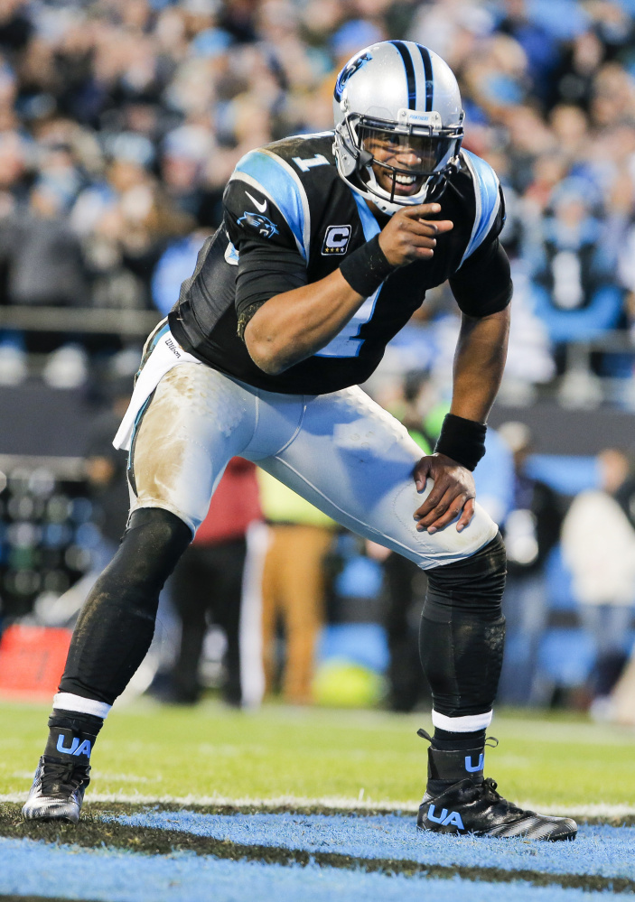 Carolina Panthers quarterback Cam Newton  celebrates a touchdown .
The Associated Press