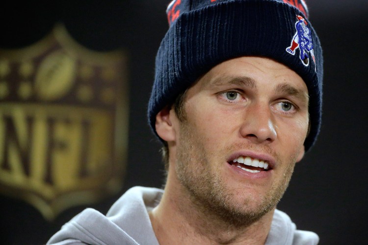 New England Patriots quarterback Tom Brady faces reporters before a scheduled NFL football practice on Wednesday in Foxborough, Mass. The Patriots are to play the Denver Broncos in the AFC Championship on Sunday in Denver.