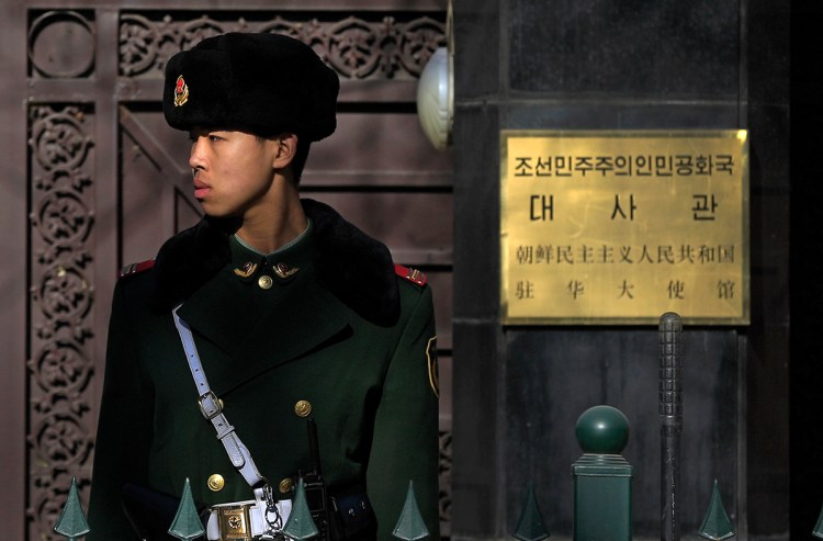 A Chinese paramilitary policeman stands guard outside the North Korean Embassy in Beijing, Wednesday. Relations between the two nations have cooled notably since Kim Jong Un's ascension to power in 2011, and the reclusive leader has yet to pay a visit to his most important sponsor and ally. The Associated Press