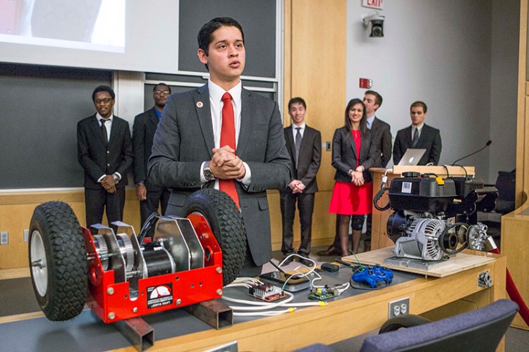 Harvard College junior Cesar Maeda explains a robotic snow blower to a group of university officials. Eighteen juniors representing several engineering disciplines spent the fall semester inventing devices to deal with snow and ice. The inventions grew out of last winter’s record snowfall, which stretched campus maintenance department workers to their limit and forced a campus shutdown for the first time since the Blizzard of ‘78. 