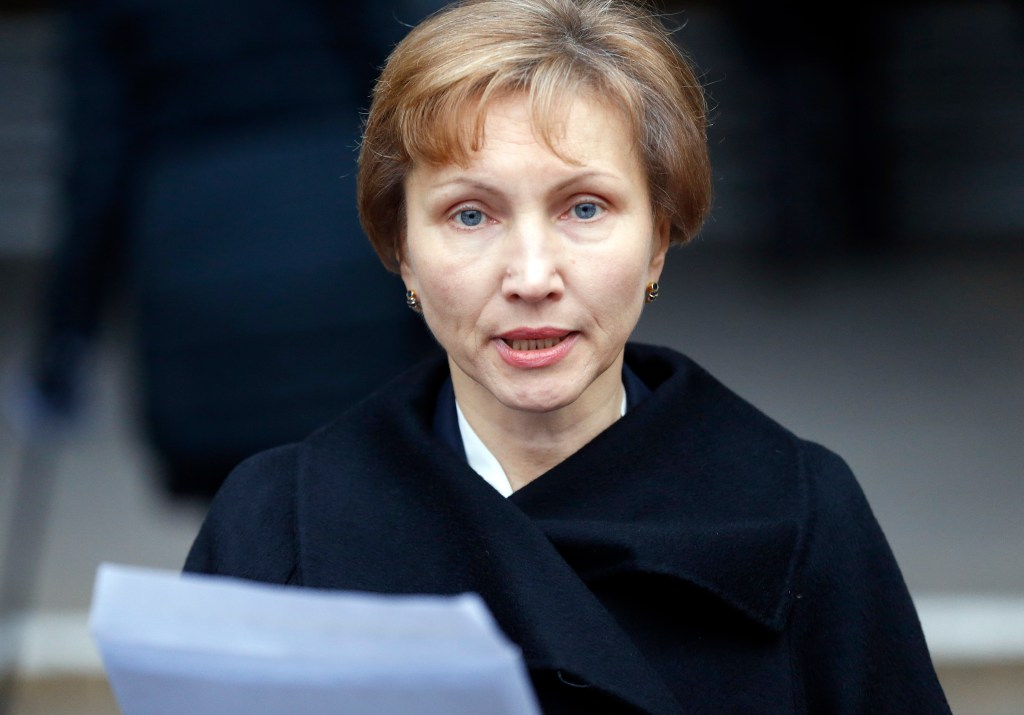 Marina Litvinenko, widow of former Russian spy Alexander Litvinenko, reads a statement outside the Royal Courts of Justice in London, Thursday. The Associated Press
