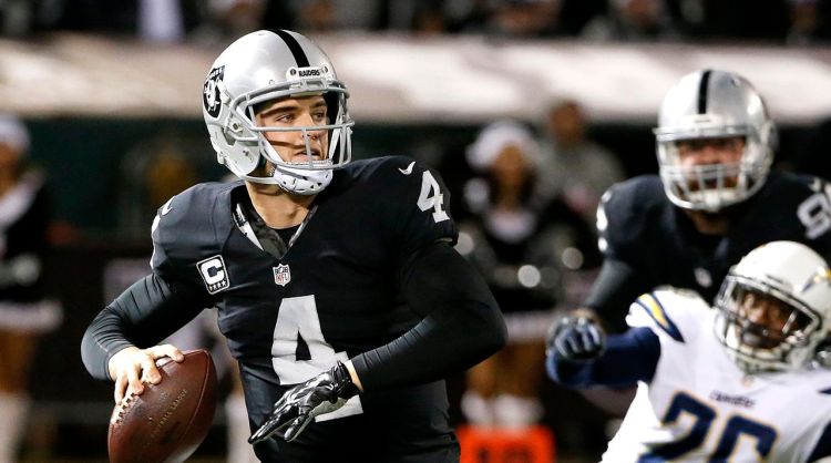 Oakland Raiders quarterback Derek Carr looks for a receiver in a Dec. 24 game against the San Diego Chargers in Oakland, Calif. The Associated Press
