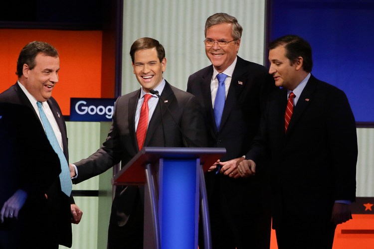 Republican presidential candidates, left to right, Chris Christie, Marco Rubio,  Jeb Bush and Ted Cruz talk after Thursday's debate, the last debate before the Iowa caucuses and the first held without Donald Trump.
The Associated Press