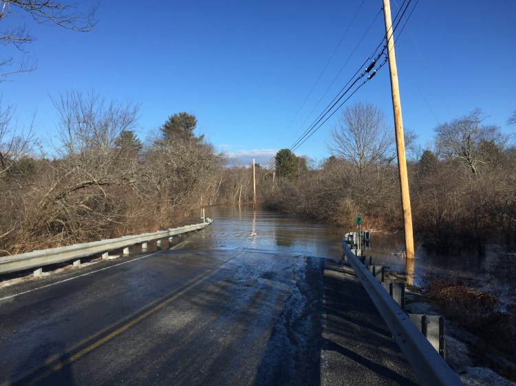 West Pownal Road in North Yarmouth is closed on Monday morning, January 11, 2016, after heavy rains and snowmelt from a storm the previous day inundated the area.