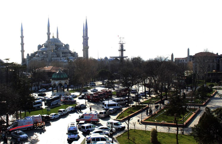 Ambulances and firefighters gather Tuesday near the Istanbul's landmark Sultan Ahmed Mosque or Blue Mosque after an explosion in the  historic Sultanahmet district, which is popular with tourists. IHA via AP