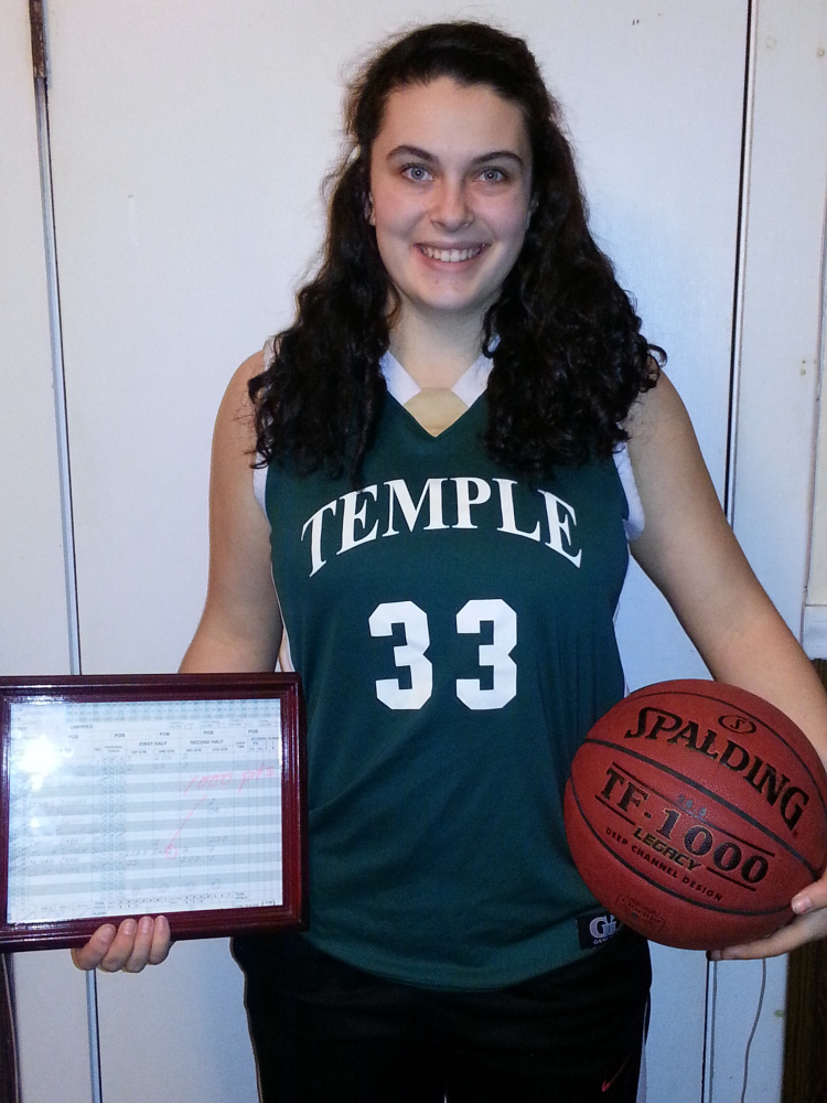 Temple junior Kiara Carr scored her 1,000th career point Saturday at Seacoast Christian. On Monday night, the school honored her with a game ball and a framed copy of the scoresheet.