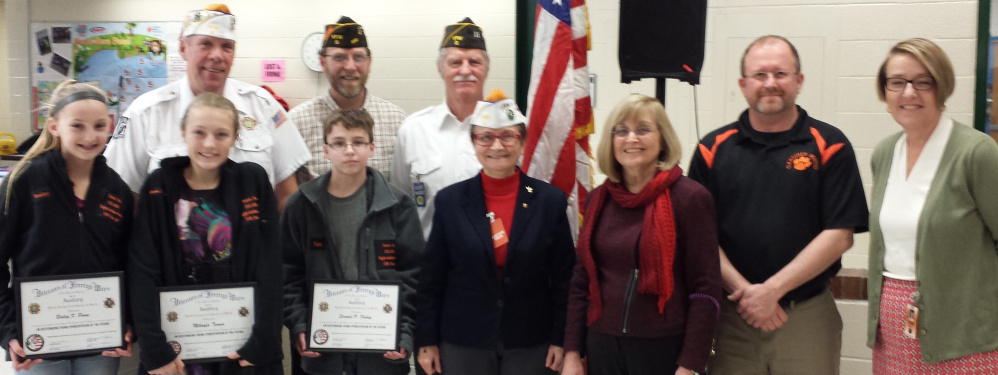 In front, from left, are Bailey Poore, who placed second; Mikayla Turner, first; Sam Farley, third; Debra Couture, Post 9 Patriot’s Pen Chairperson; Donna Whelan, GRMS teacher and Patriot’s Pen Chairperson; Todd Sanders, GRMS Principal; and Pat Hopkins, MSAD 11 Superintendent. Back from left are, Roger McLane, Post 9 commander; Roger Line, Post 9; and Greg Couture, Post 9.