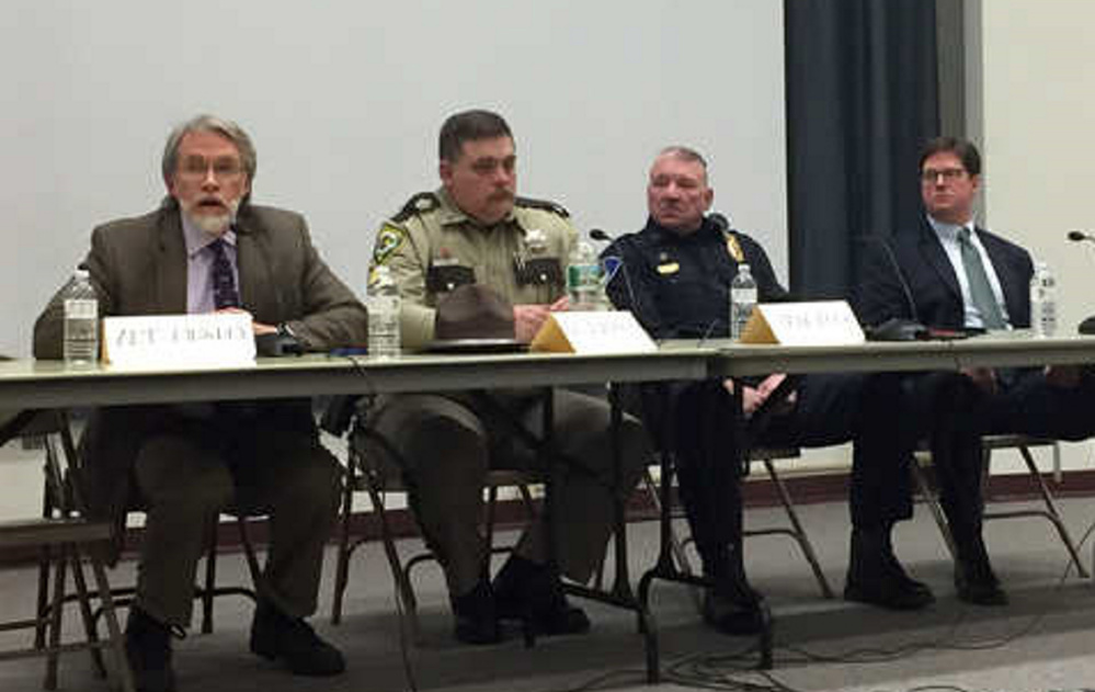 Psychiatrist Art Dingley talks as Oxford County Deputy Matt Baker, Farmington Police Chief Jack Peck and Franklin County District Attorney Andrew Robinson listen during a panel Wednesday night on heroin and opiate addiction in Franklin County.