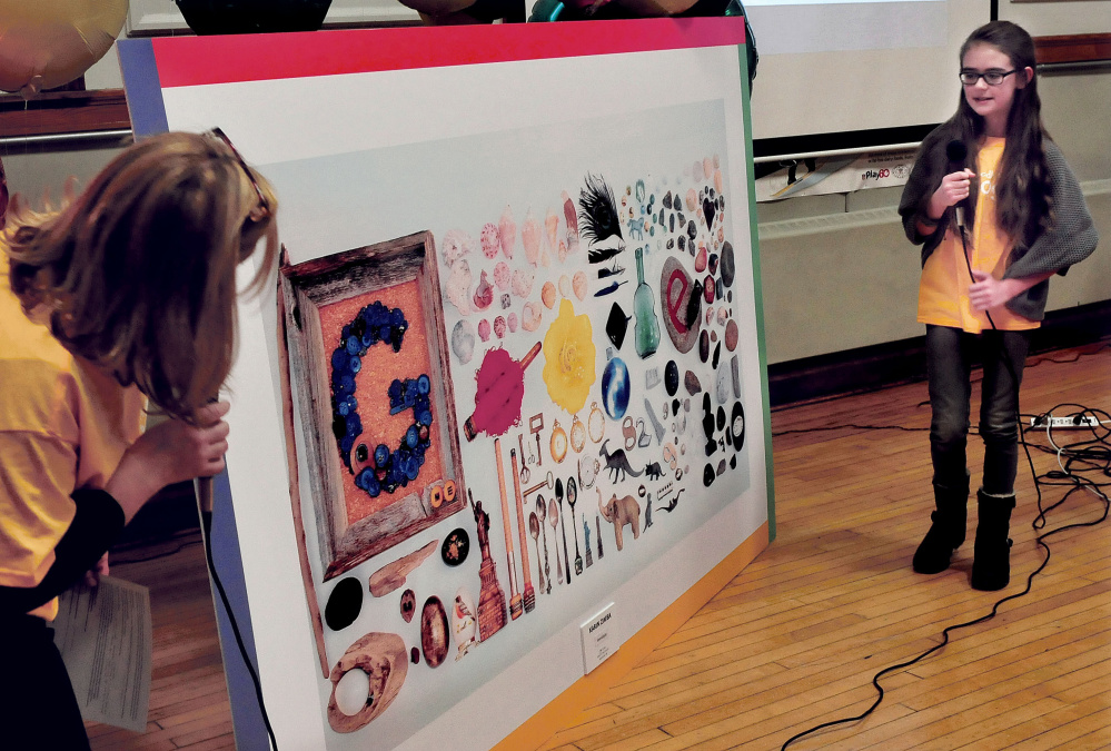 Albert S. Hall School art teacher Hollie Hilton looks on as fifth-grade student Karin Zimba explains her artwork project “Serendipity” she created that was picked as the Maine winner in the annual national Doodle 4 Google contest. Her sister, Inga, won two years ago.