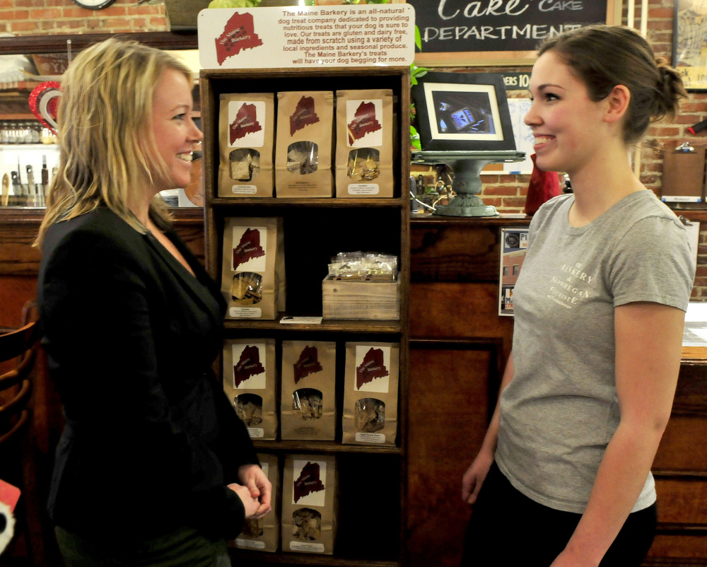 Maine Barkery owner Amanda Clark, right, speaks with Kristina Cannon, executive director of Main Street Skowhegan, who offered congratulations to Clark for winning a local Entrepreneur Challenge worth $20,000.