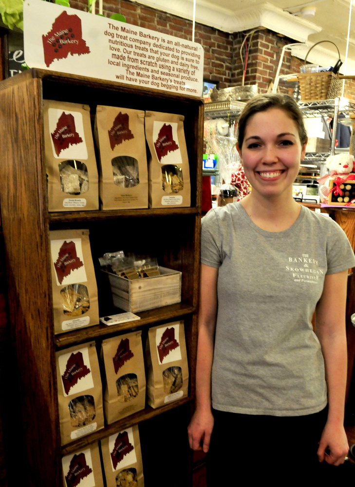 Amanda Clark is seen Monday beside some of the products her new company, The Maine Barkery, makes in Skowhegan. Clark has received a $20,000 incentive package.