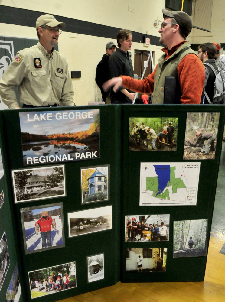 Derek Ellis, left, a park ranger at Lake George Regional Park in Skowhegan, speaks about his work to Unity College alumnus Dave Hammond during a well-attended annual Environmental Jobs Fair on Tuesday.