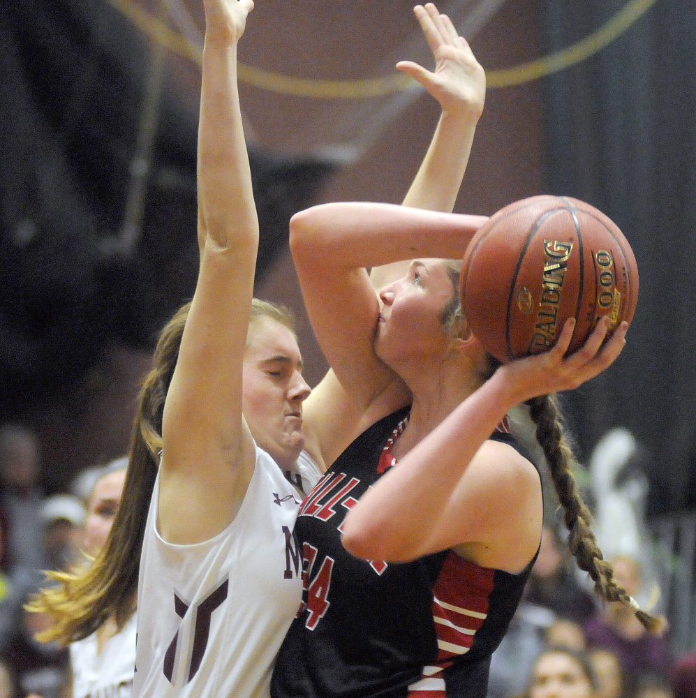 Monmouth’s Abbey Allen blocks defends Hall-Dale’s Kayla Johnson during a Class C South prelim game Tuesday in Monmouth.
