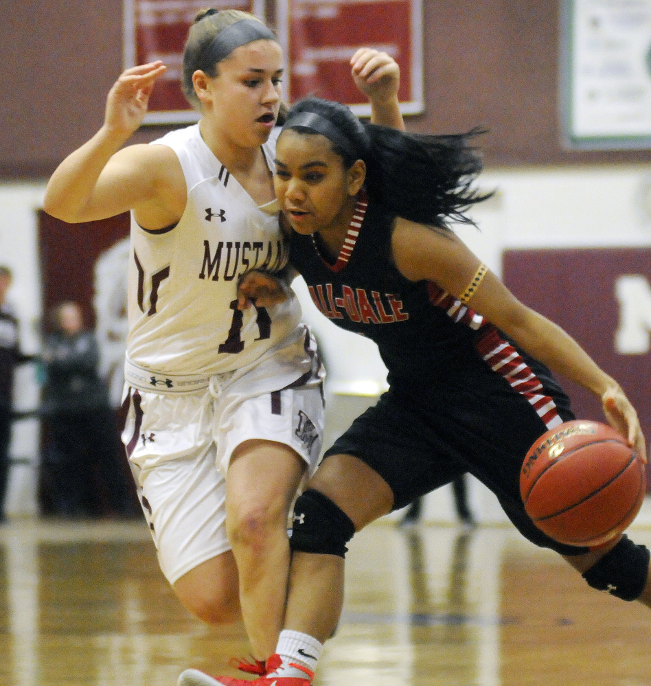 Monmouth’s Hannah Anderson, left, defends Hall-Dale’s Dani Sweet during a Class C South prelim game Tuesday in Monmouth.