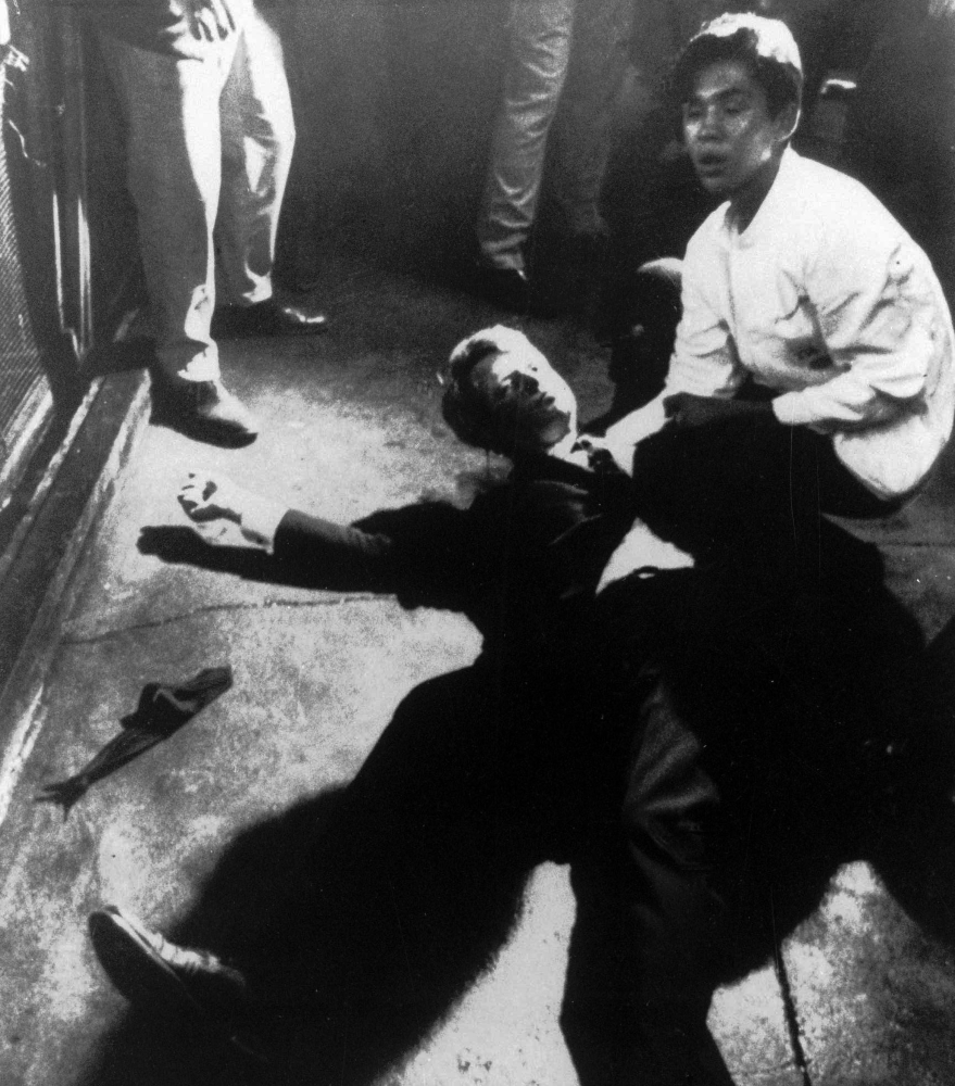 In this June 5, 1968 file photo, Sen. Robert F. Kennedy awaits medical assistance as he lies on the floor of the Ambassador hotel in Los Angeles moments after he was shot.