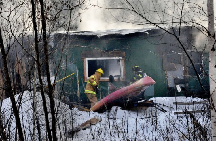 Firefighters from Anson, Madison and Skowhegan battle a fire that destroyed a home on Horseback Road in Anson Thursday morning.