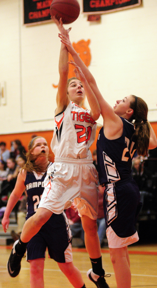 Gardiner’s Mary Toman shoots over Hampden’s Sophia Narofsky during a game last month in Gardiner. The No. 3 Tigers play No. 6 Mt. Blue in a Class A North quarterfinal game Friday at 3:30 p.m. in the Augusta Civic Center.