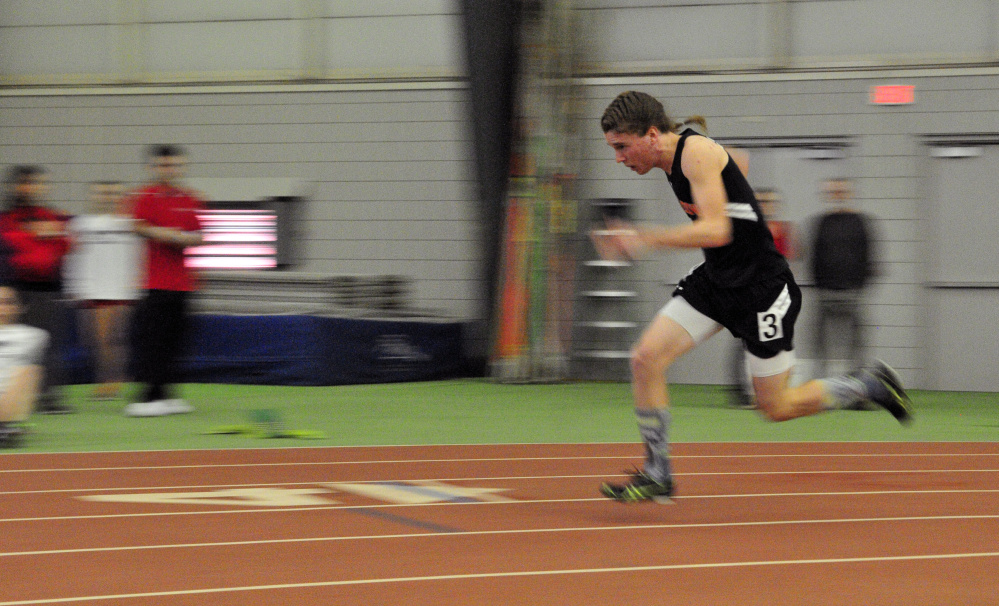 Winslow’s Ben Smith competes in the 200-meter sprint during the Kennebec Valley Athletic Conference Class B indoor track championships last Saturday at Bowdoin College in Brunswick.