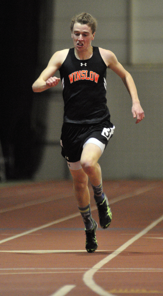 Winslow’s Ben Smith pushes ahead in the 200-meter sprint during the Kennebec Valley Athletic Conference Class B indoor track championships last Saturday at Bowdoin College in Brunswick.