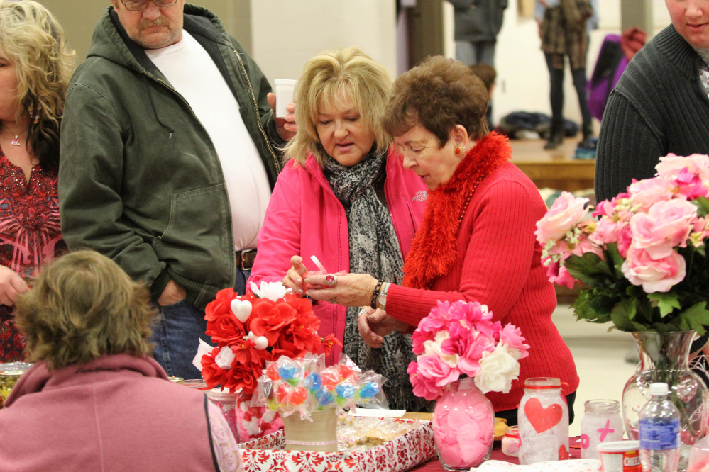 Linda Donahue, of Clinton, and her mother-in-law, Joanne Donahue, of Fairfield, pick out some treats Saturday at the annual Fairfield Chocolate Festival. The event, held in the Fairfield Community Center, raised money for the Fairfield Council of Churches Emergency Heating Fund.
