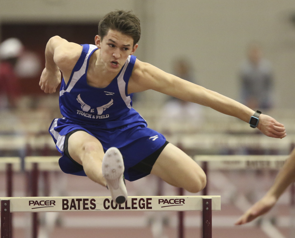 Erskine’s Ethan Dodge clears the final hurdle of the 55-meter hurdles at the Class B state indoor track and field championship Saturday at Bates College.