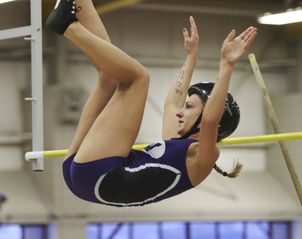 Waterville senior Alison Linscott clears the bar during the pole vault competition at the Class B state indoor track and field track championships Saturday at Bates College.