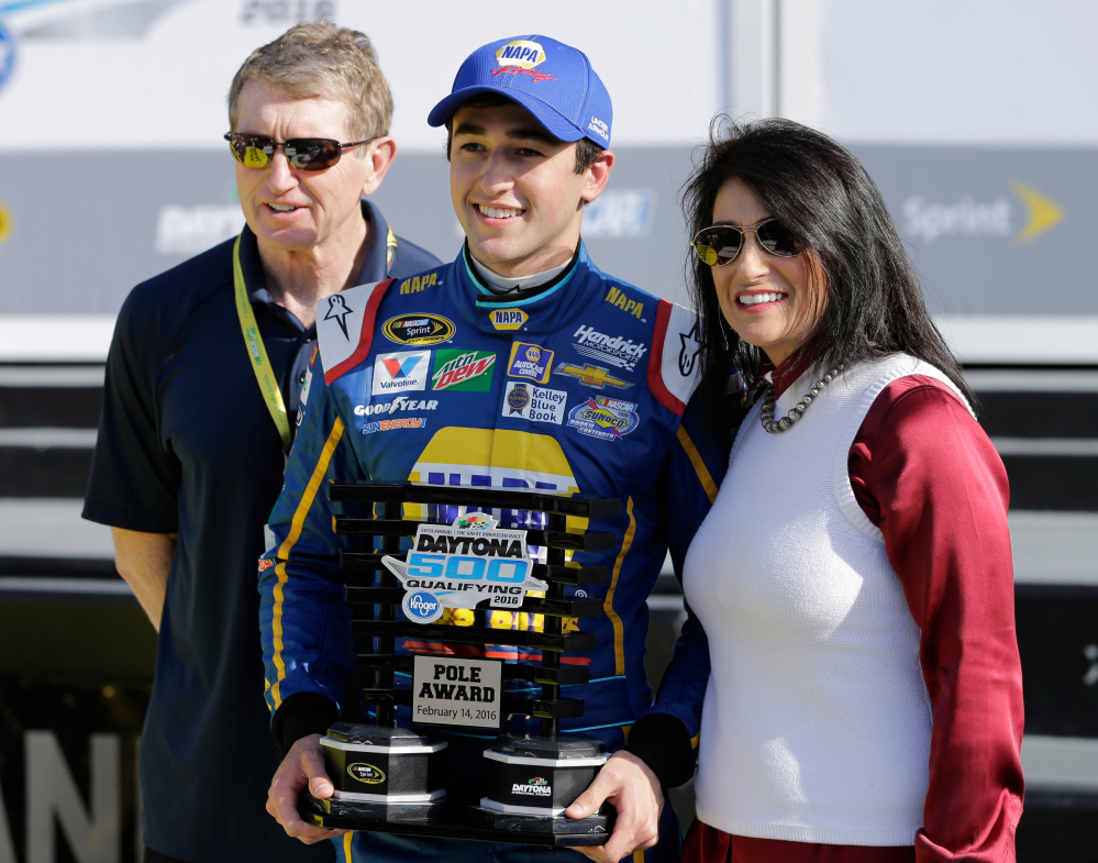 Chase Elliott, center, poses with his parents, former NASCAR driver Bill Elliott, left, and Cindy Elliott, after he qualified for the pole position in the Daytona 500 on Sunday at Daytona International Speedway in Daytona Beach, Fla.(AP Photo/Terry Renna)