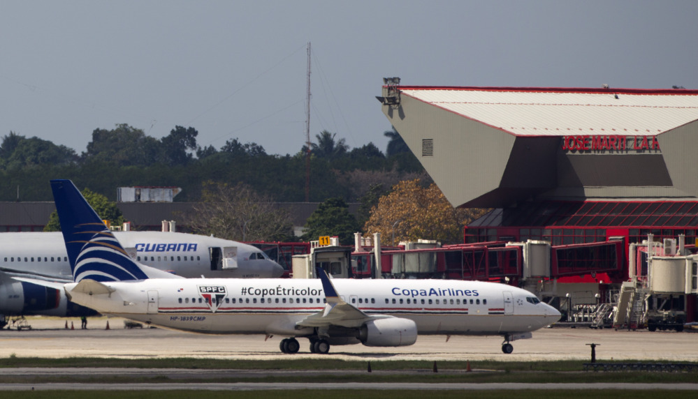 In this Sunday photo a Copa Airlines aircraft taxis beside a Cubana airlines, aircraft at the international terminal of the Jose Marti Airport in Havana, Cuba.