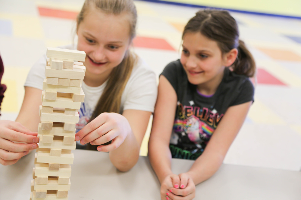 “Big Sister” Fern Calkins enjoys spending one hour each week with her “Little Sister” Lyndsey at Williams Elementary School in Oakland. Their year-long friendship is the result of a Big Brothers Big Sisters of Mid-Maine’s site-based mentoring program that will expand next month to include 40 new matches at the Alfond Youth Center in Waterville.