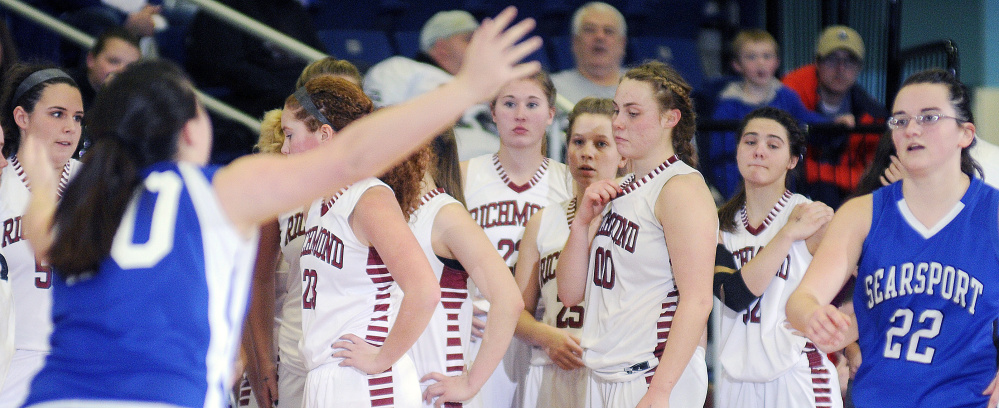 Staff photo by Andy Molloy
Members of the Richmond girls basketball team wait on the sidelines as Searsport players celebrate their Class C South quarterfinal victory Tuesday at the Augusta Civic Center.