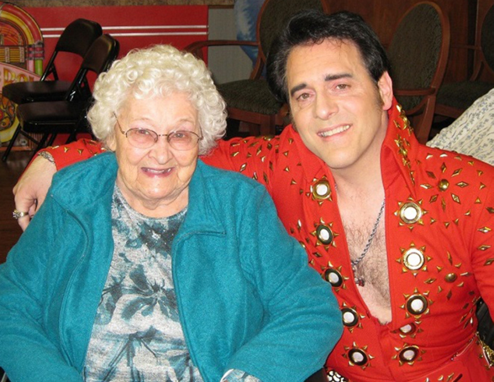 Resident Karleen Collins and Elvis impersonator Don Boudreau.