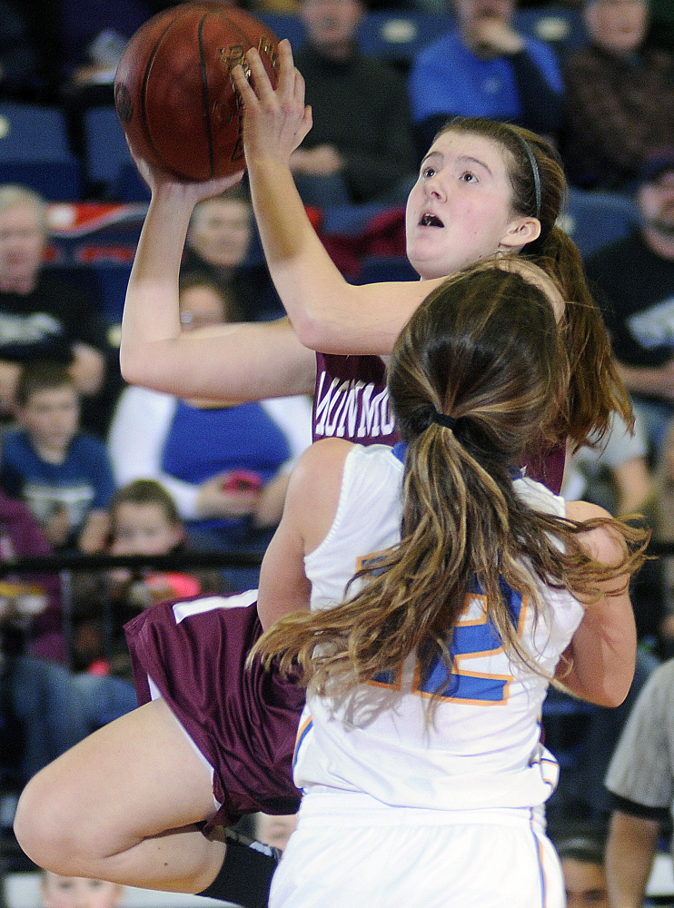 Monmouth’s Abbey Allen gos up for a basket over Boothbay’s Kate Friant during a Class C South semifinal Thursday afternoon at the Augusta Civic Center.
