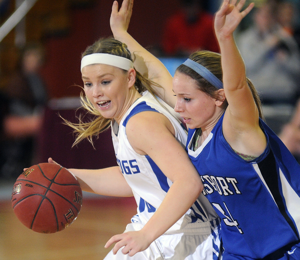 Madison Area Memorial High School’s Madeline Wood, left, maneuvers around Searsport District High School’s Karigen Coffin during a Class C South semifinal game Thursday in Augusta.