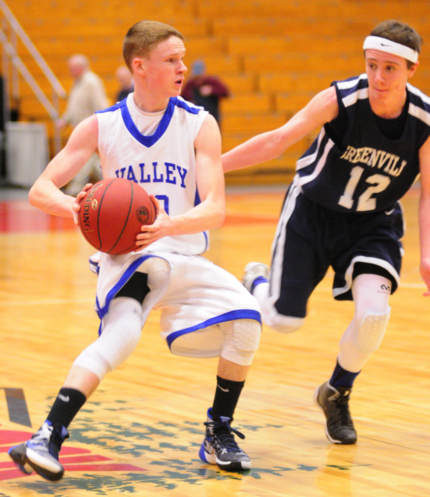 Valley’s Luke Malloy, left, looks to pass against Greenville’s Noah Pratt during a Class D South semifinal game Wednesday at the Augusta Civic Center.