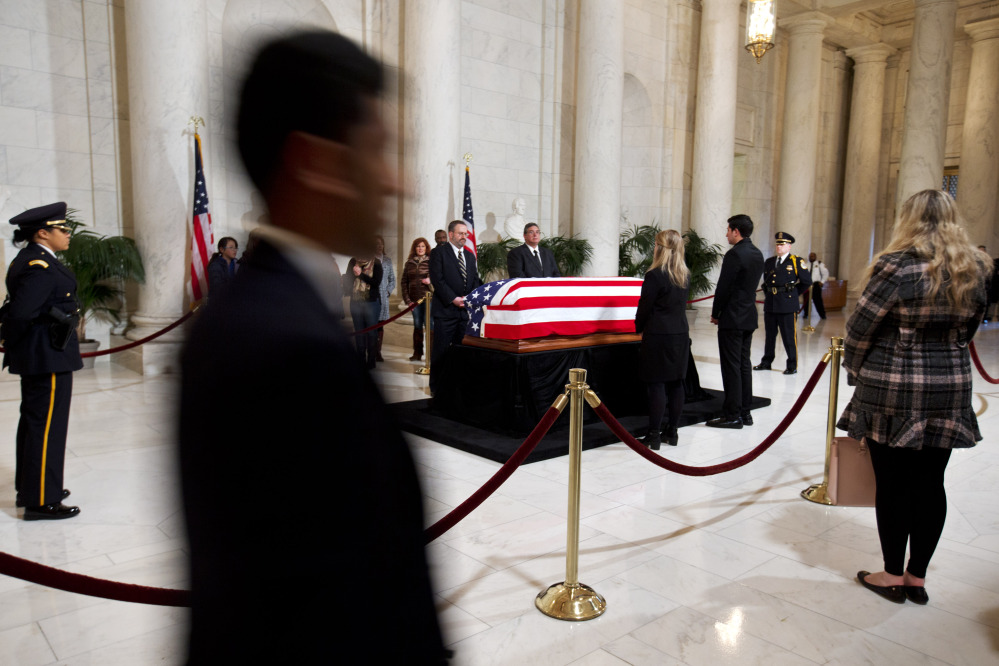 Members of the public attend a visitation in the Great Hall of the Supreme Court where Supreme Court Justice Antonin Scalia lies in repose in Washington on Friday.