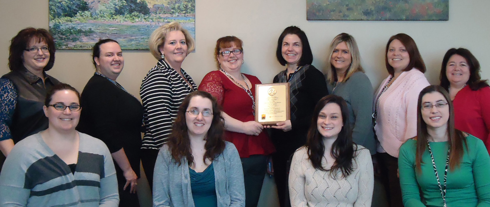 Staff members of Gardiner Federal Credit Union display a plaque they received in the past week from the Maine Credit Union League for their efforts to raise money to aid the hungry. In front, from left, are Wendy Roberts, Hillary Greenleaf, Jenni Prue and Stephanie Rolfe. In back, from left, are Kelly Marie, Katie Trask, Laura Naas, Julie Chandler, Erica O’Connor, Sue Morse, Tracie James and Vicki Larrabee.