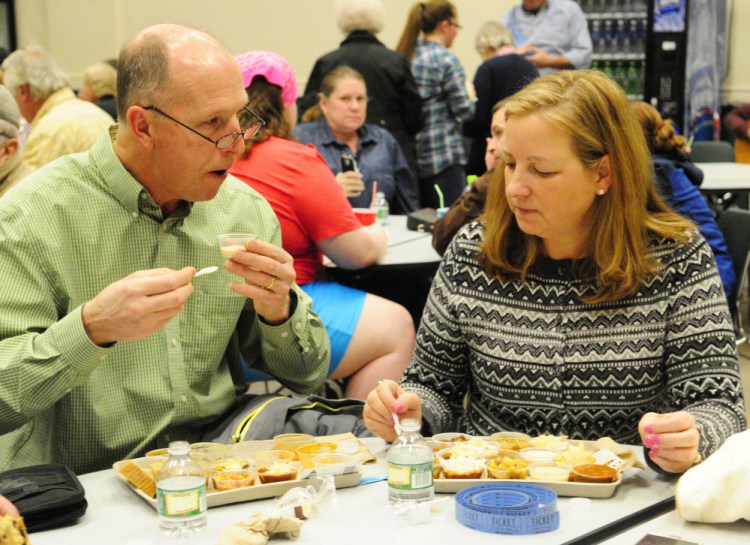 Mark and Lillian Lake, of Wilton, discuss how they like their many samples during the chili and chowder fundraiser event on Saturday at Winthrop High School.