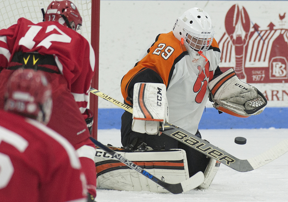 Gardiner goalie Michael Poirier makes a save during a game against Cony earlier this season at the Ice Vault in Hallowell. Poirier and Tigers open the B South payoffs Tuesday night against Gorham.