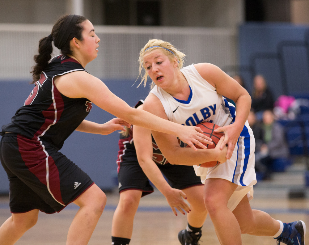 Colby College’s Carylanne Wolfington, of Hallowell, protects the basll in a game against the Massuchesetts Institute of Technology on November 22, 2014 in Waterville, ME.