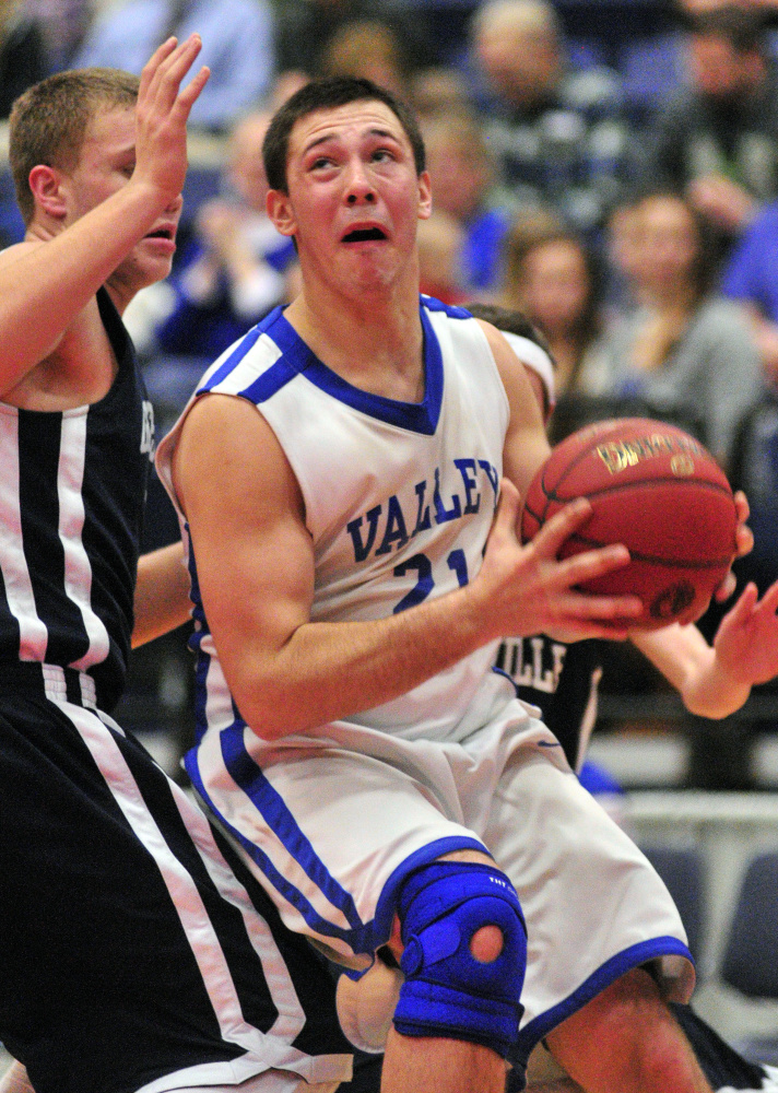 Valley’s Collin Miller drives to the basket against Greenville during a Class D South semifinal game against earlier this month at the Augusta Civic Center.