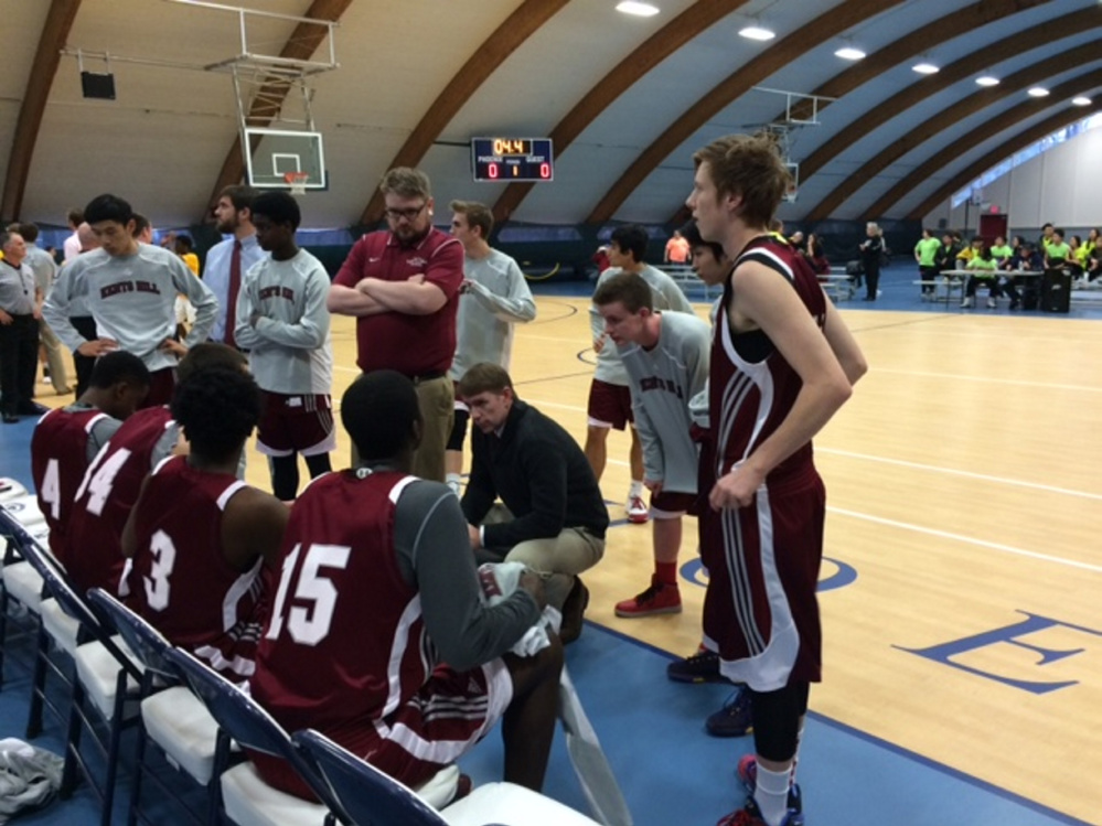 The Kents Hill boys basketball team huddles up during a game against Hyde School earlier this season.