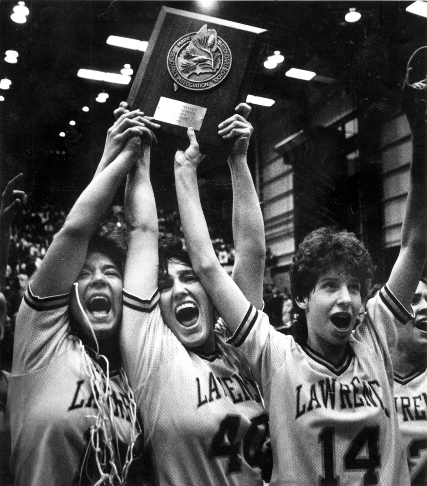 Cindy Blodgett, far right, with Lawrence High School teammates Taffy Witham, left, and Marsha Hamlin, center, celebrate their Eastern A championship over Stearns, 64-49, in the Bangor Auditorium in March 1992.
