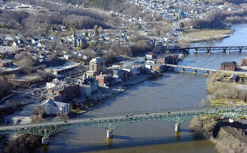 This April 2007 aerial photo shows the Kennebec River in Augusta. The Memorial Bridge runs across the bottom, then the Calumet Bridge at Old Fort Western and then a railroad bridge.