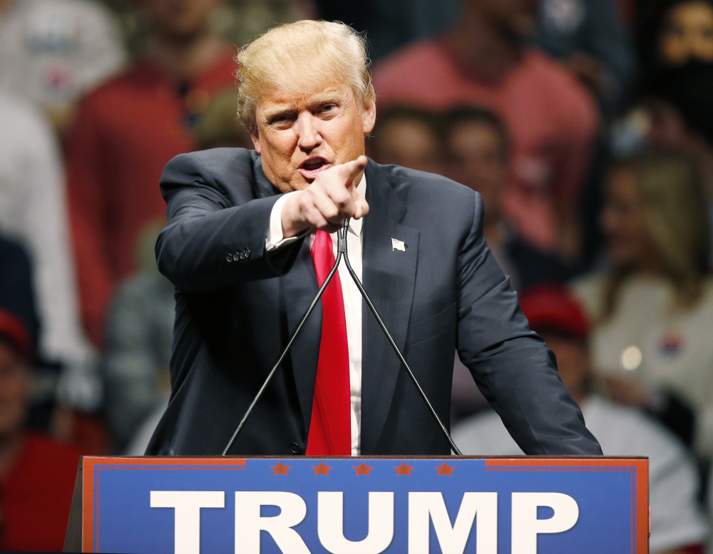Republican presidential candidate Donald Trump gestures during a speech to a rally in Oklahoma City, Friday.
