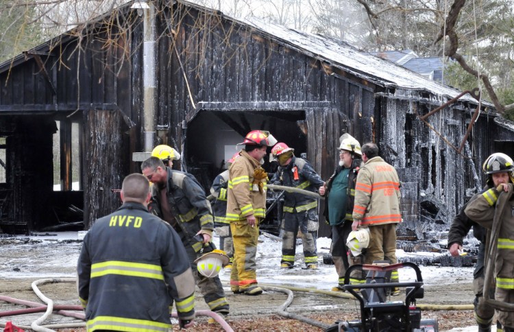 Firefighters from several departments put out the fire that destroyed a garage and tools at a home on the Huff Hill Road in Hartland on Sunday.
