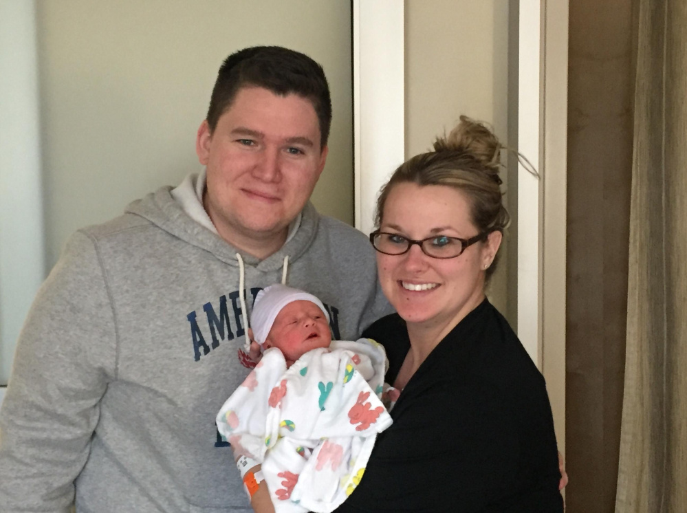 Brandon and Kristen Gilley of Waterville hold their new baby boy, Jackson Gilley, who was born Monday, leap day, which occurs on the calendar only once every four years.